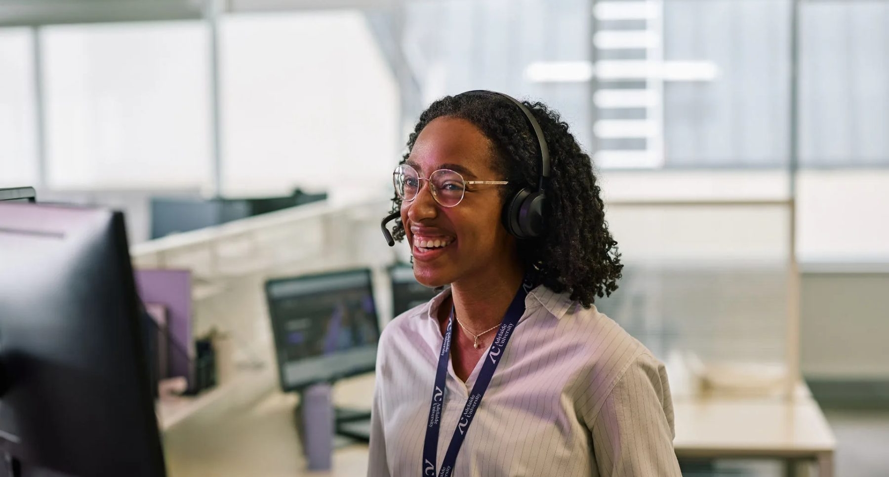AU support woman wearing a headset 