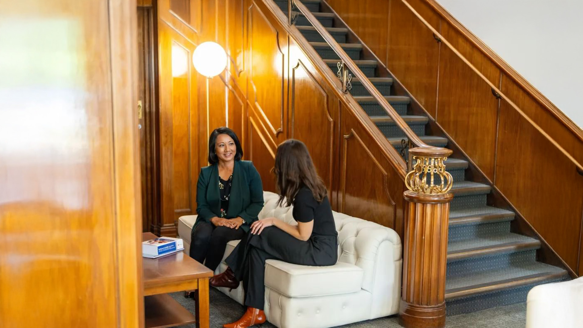 Two people sitting and talking