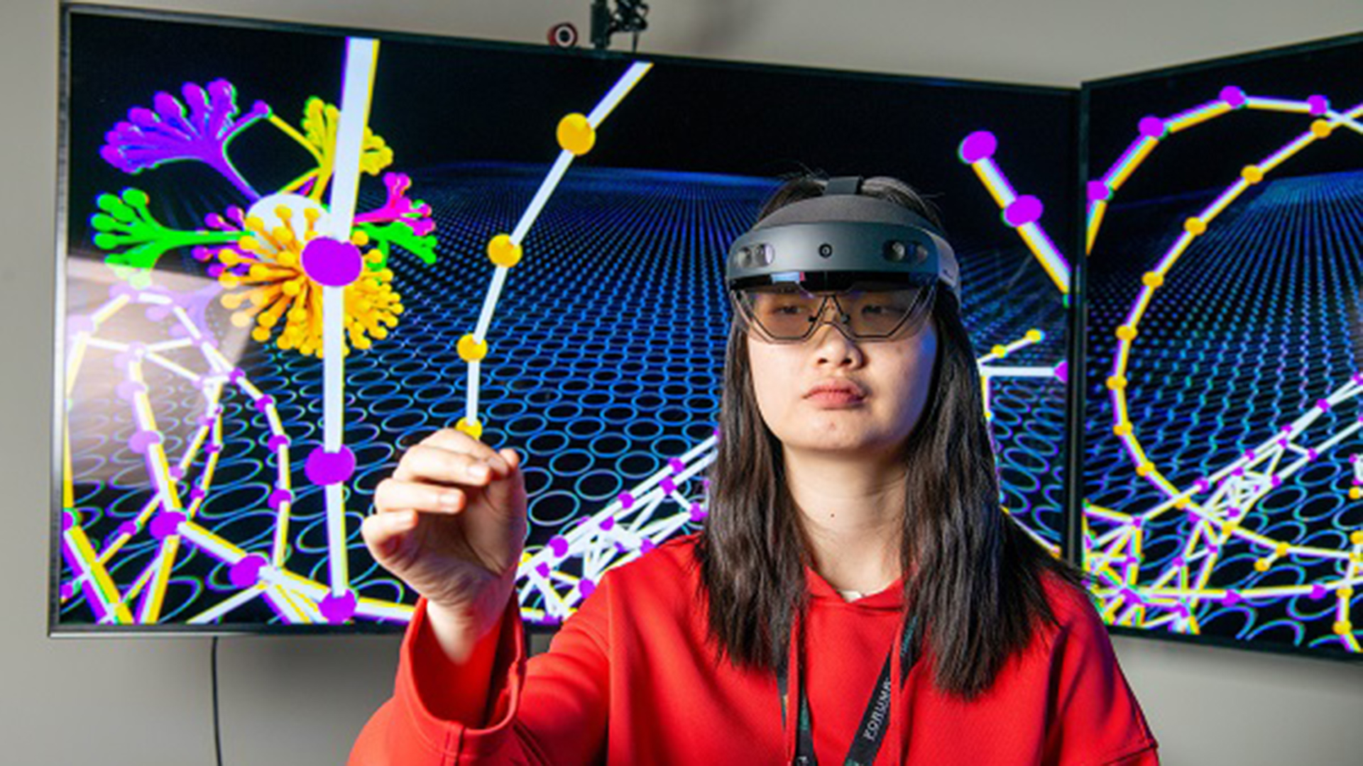 IVE Emphatic Computing photo showing a woman and a screen in the background