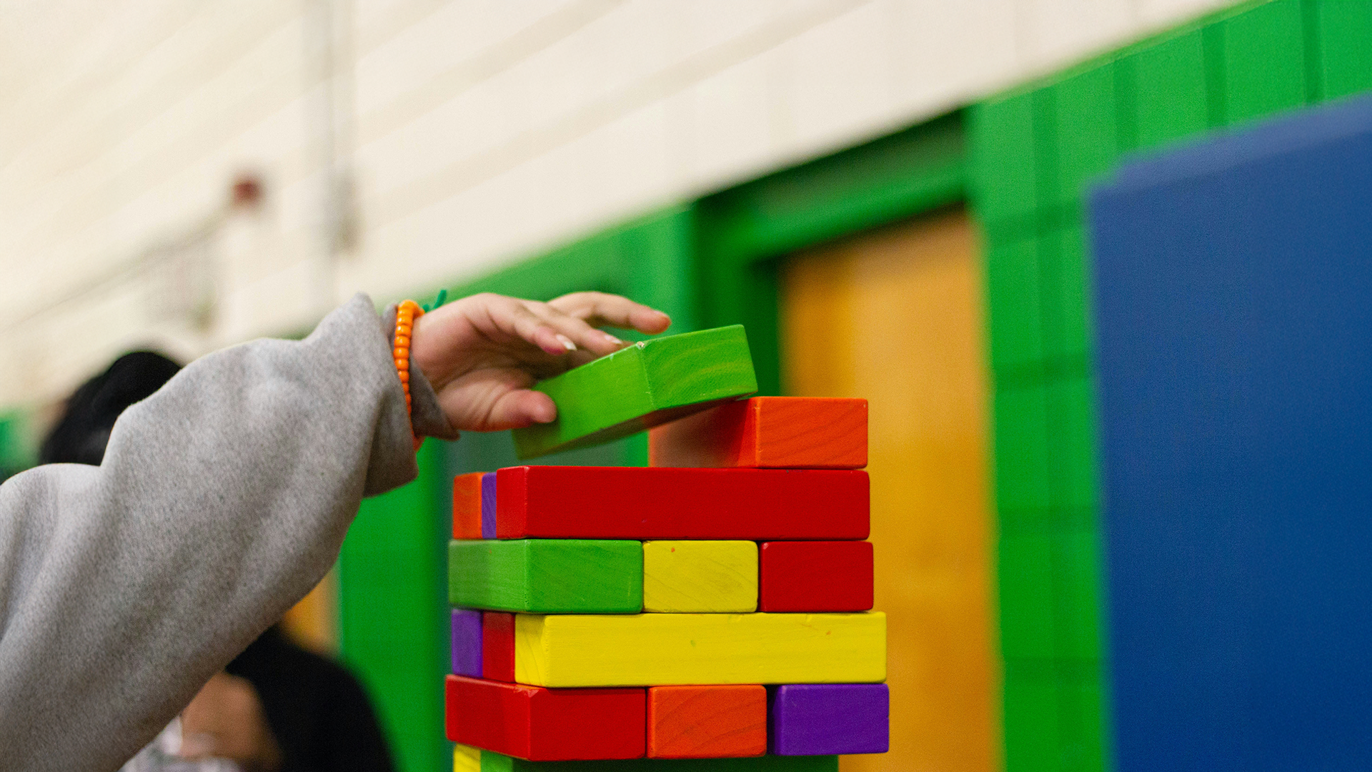 Kid playing jenga