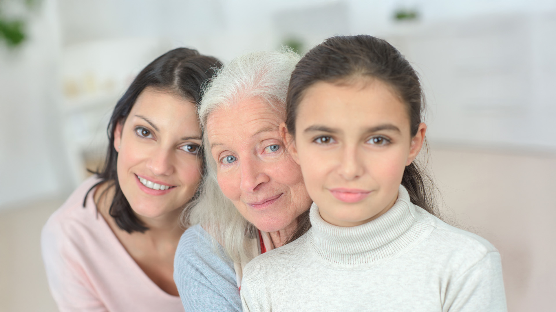 Three women smiling