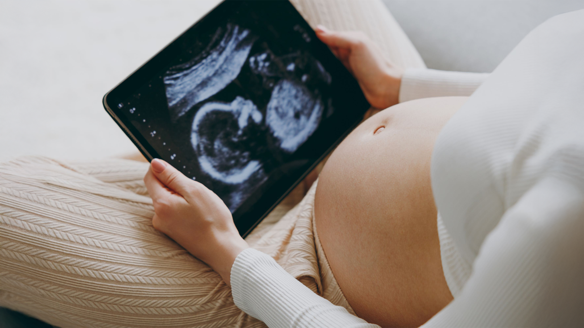 Woman looking at ultrasound image
