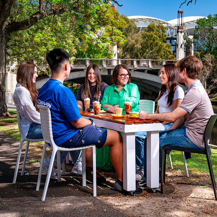 Students and teacher sitting and talking