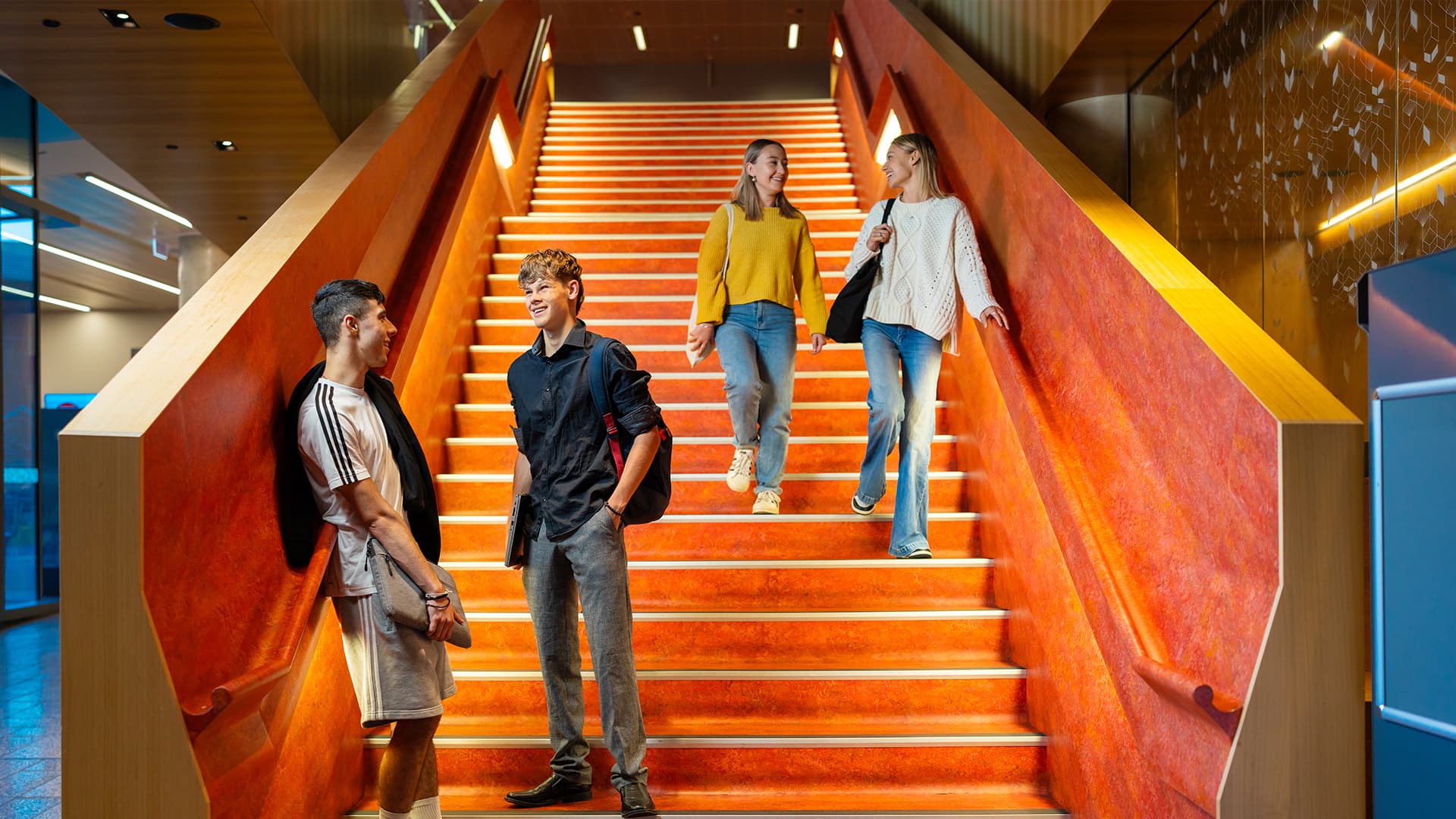 Adelaide University students talking on campus