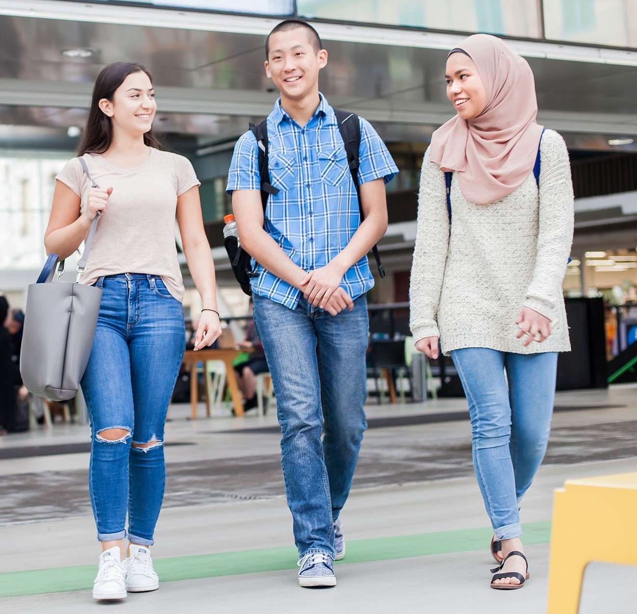 Three students walking together