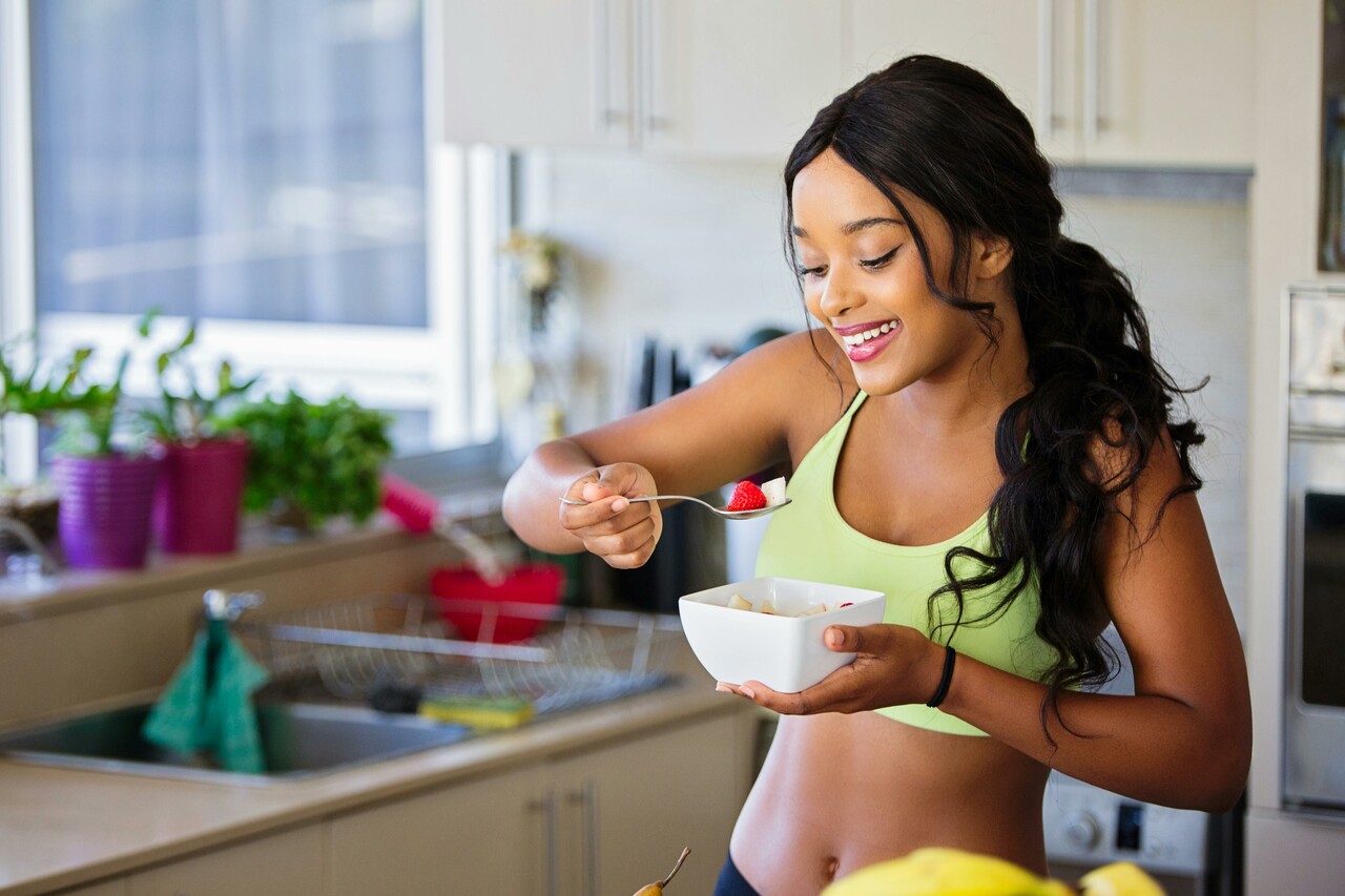 Woman eating strawberries