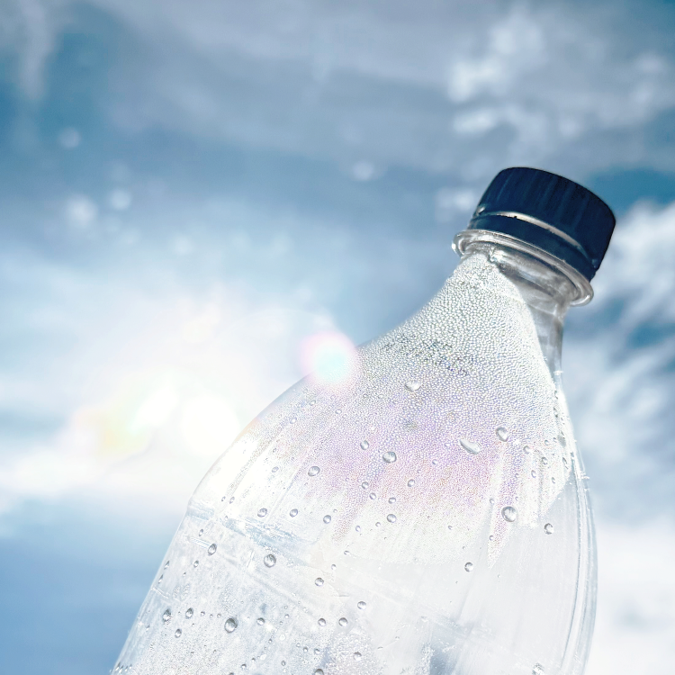 plastic bottle in the foreground of blue sky