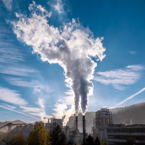 factory smoke coming out of large smoke stack