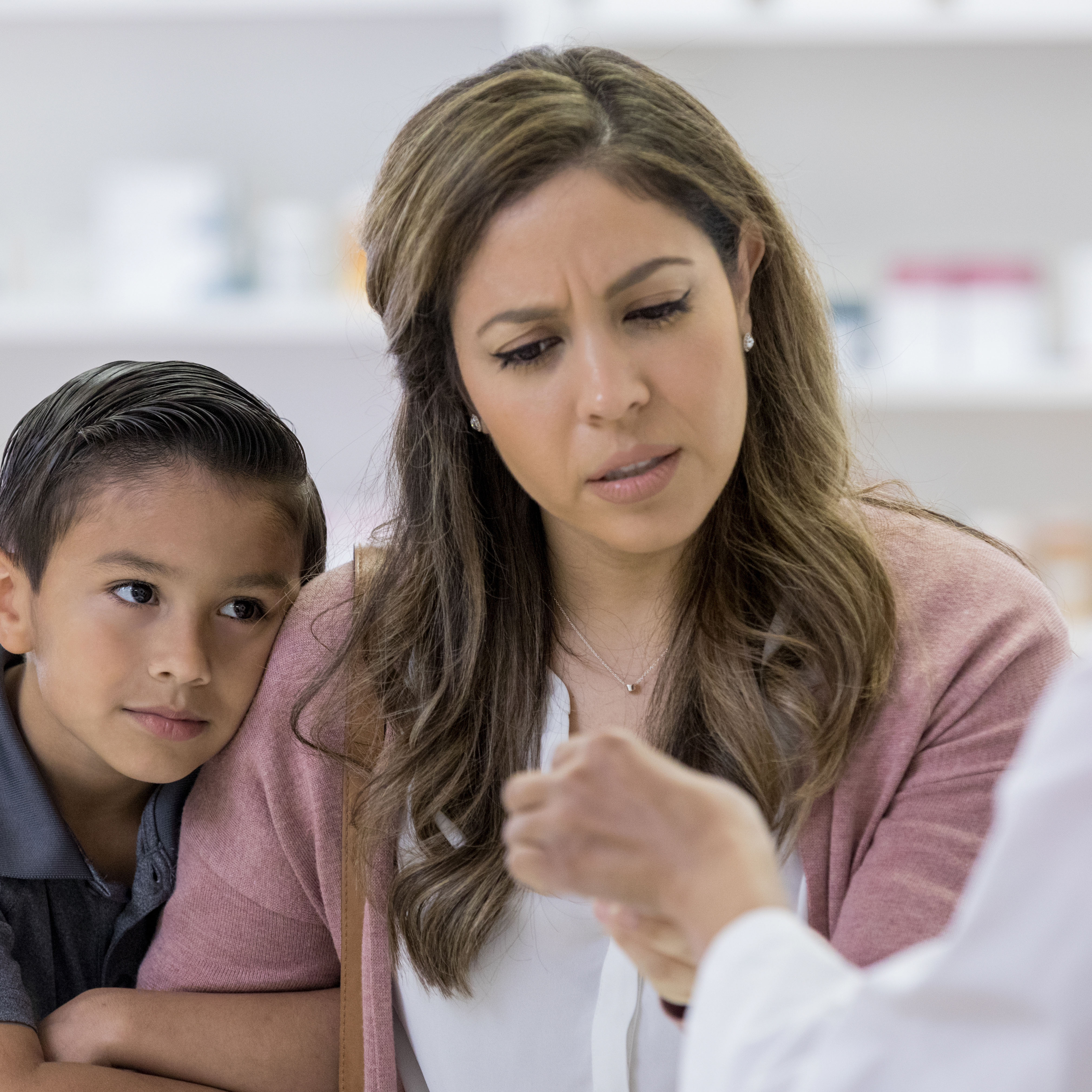 woman with a child confused about medicine