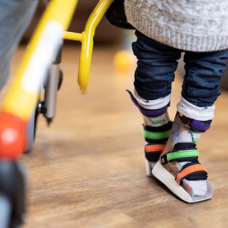 Stock image of child with cerebral palsy braces
