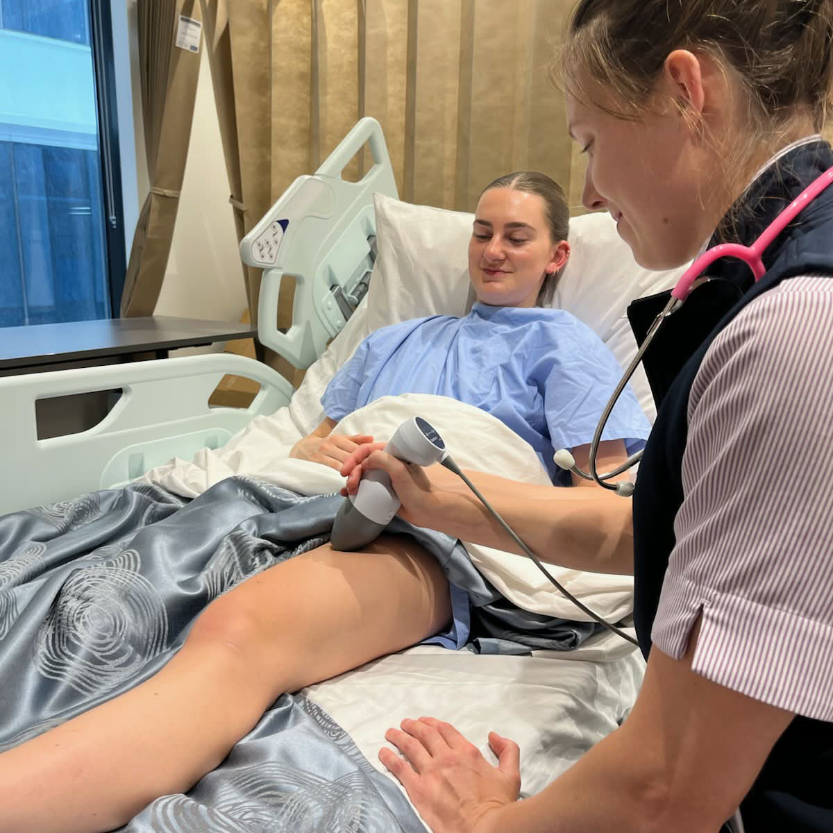 woman getting an ultrasound on her thigh 