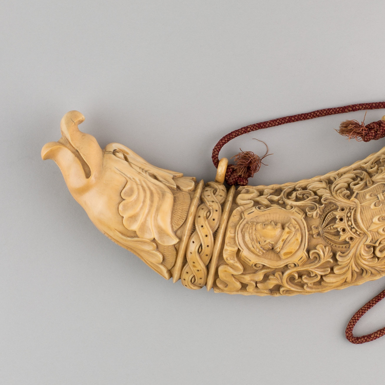 A carved ivory horn