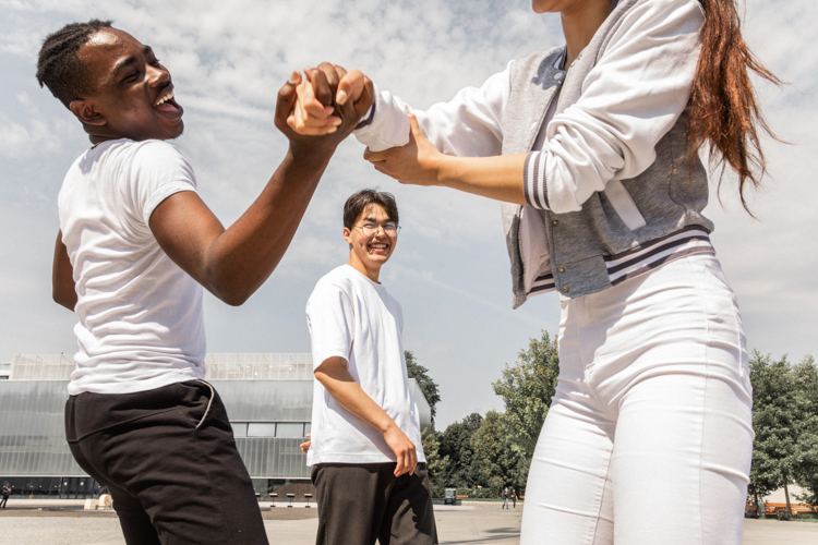 A group of teenagers laughing together