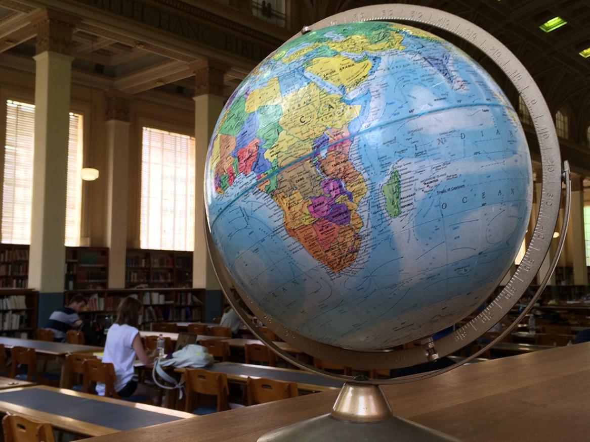 globe in front of library