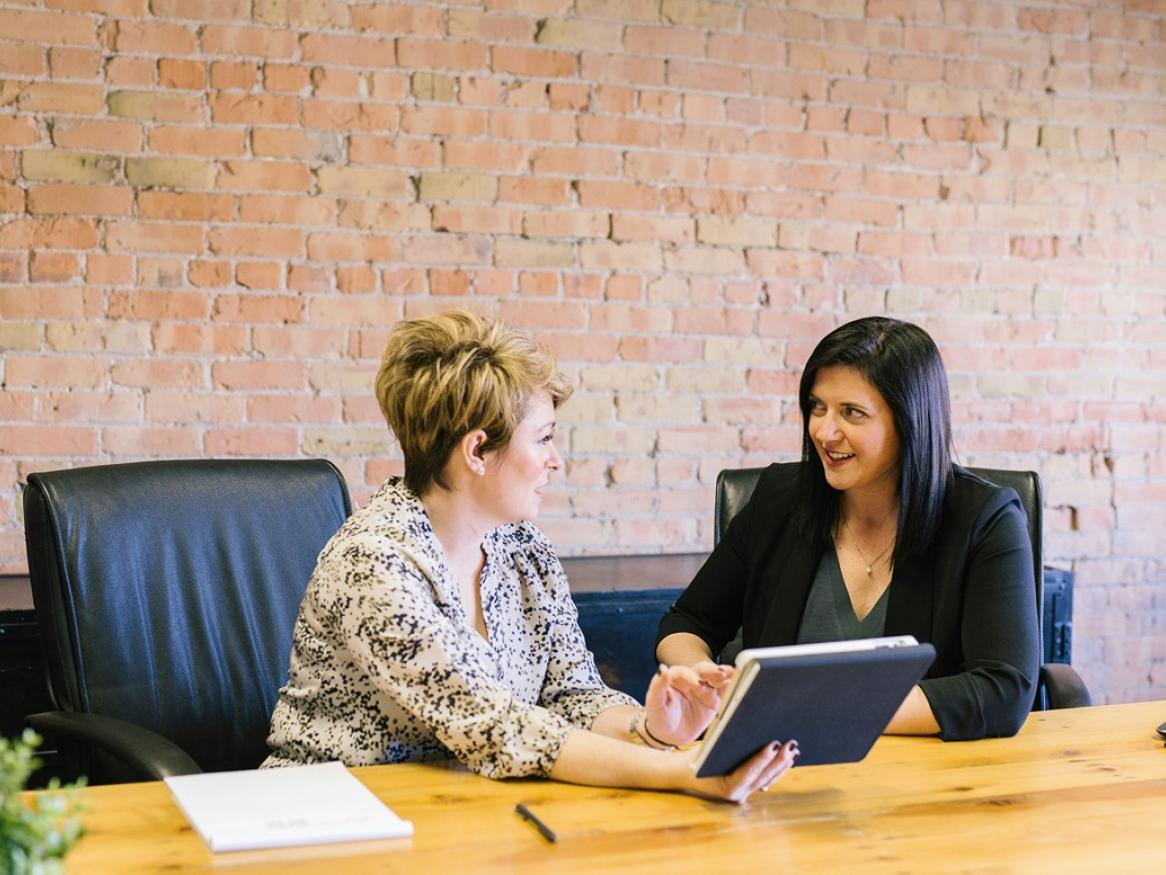 Two staff members talking