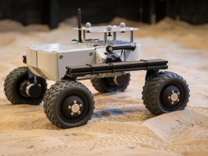 Space rover on sand