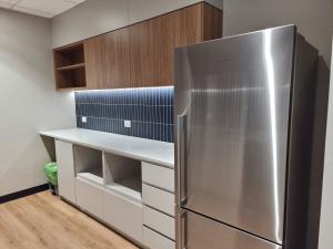 250 North Terrace kitchenette with chrome fridge and tiled splash-back