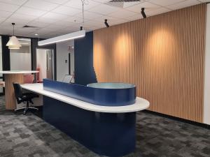 250 North Terrace open plan office with large workbench and acoustic wall panel