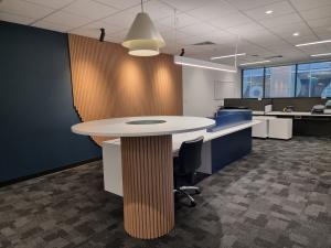 250 North Terrace open plan office with high table and long low workbench