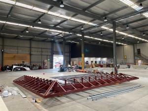 Bonython Hall amenities block wooden canopy on floor of warehouse