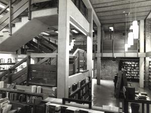 Black and white image of the staircase in the George Murray Bookshop in the 1970s