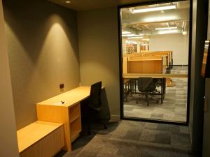 Window looking out to the Barr Smith Library desks from the Digital Presentation Suite