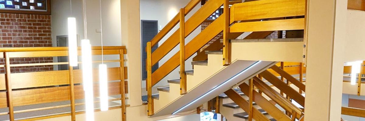 George Murray bookshop interior with wooden staircase