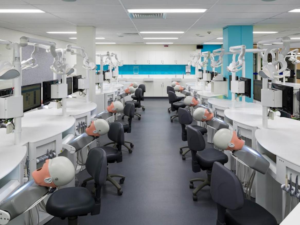 Dental Simulation Clinic with rows of mannequins and equipment