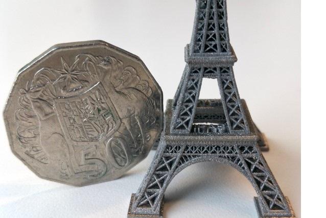 comparing print resolution on 3d printed Eiffel Tower compared to Australian 50c coin