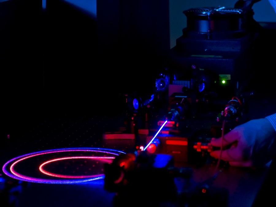  laser shines through optical fibres