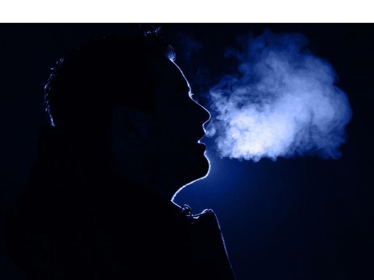 Man breathing in the cold with visible breath