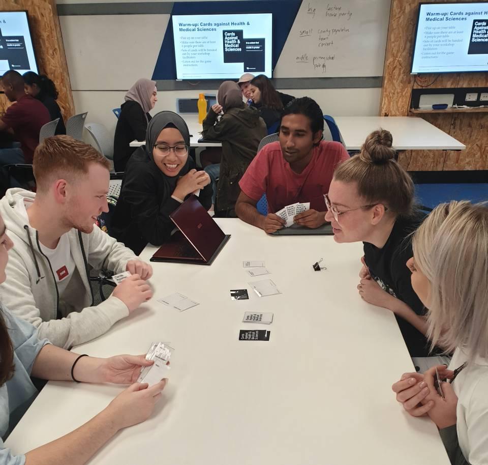 Students enjoy playing the card game 