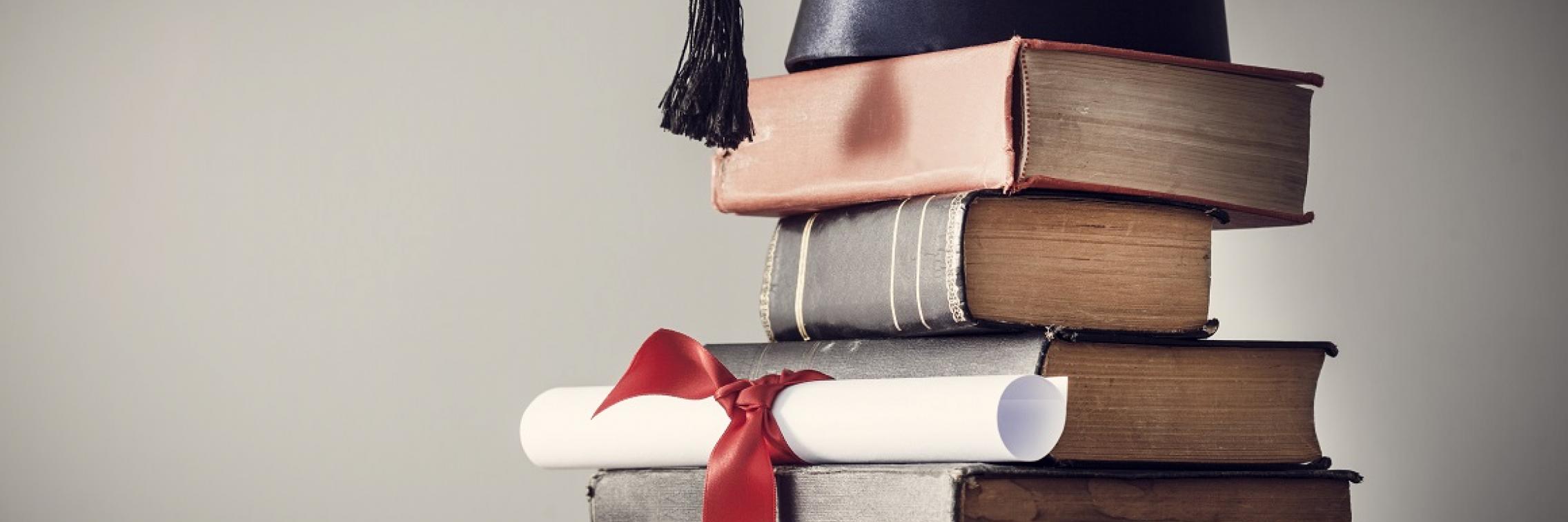 Graduation cap and books