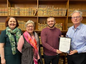 L to R: University Librarian Sian Woolcock, Robina Weir, Alex Sanders, and Glen Weir