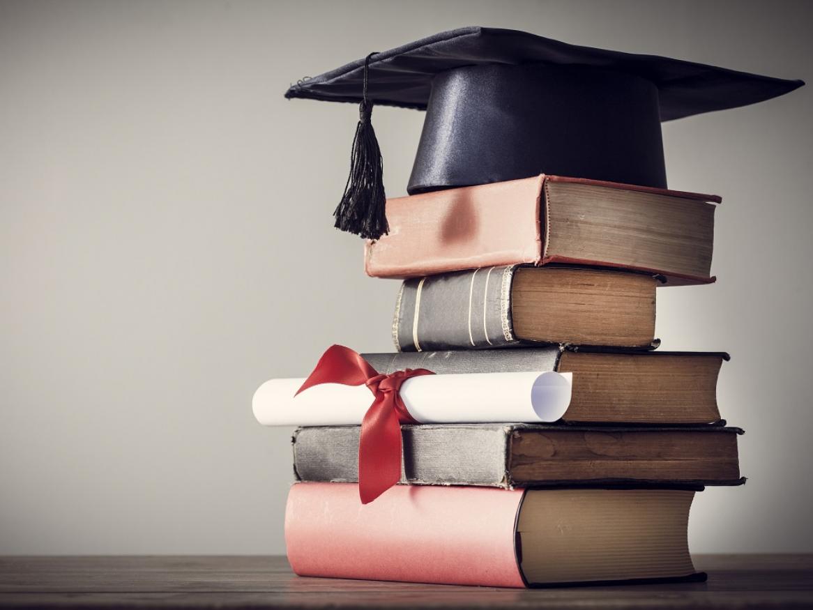 Graduation cap and books