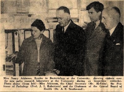 Nancy Atkinson showing visitors the new Polio Research Laboratory