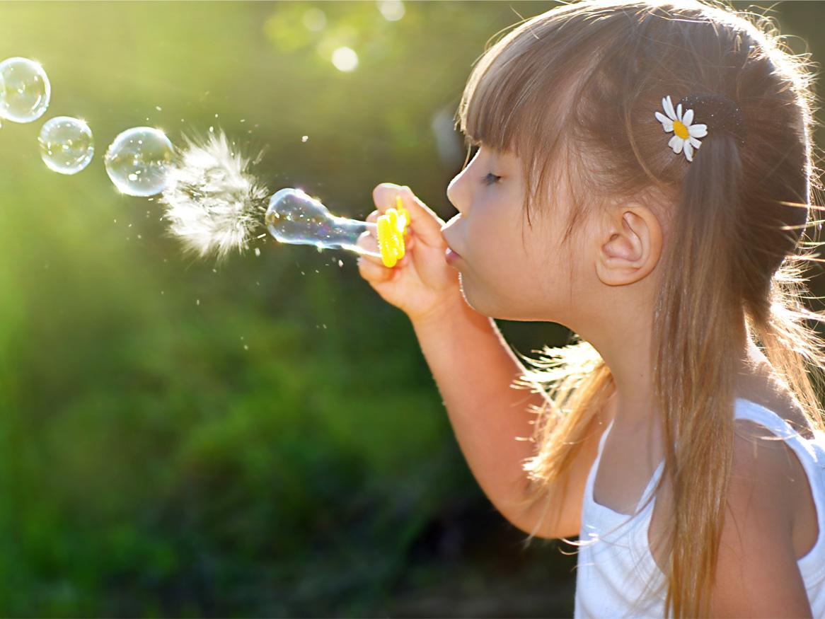 Girl blowing bubbles