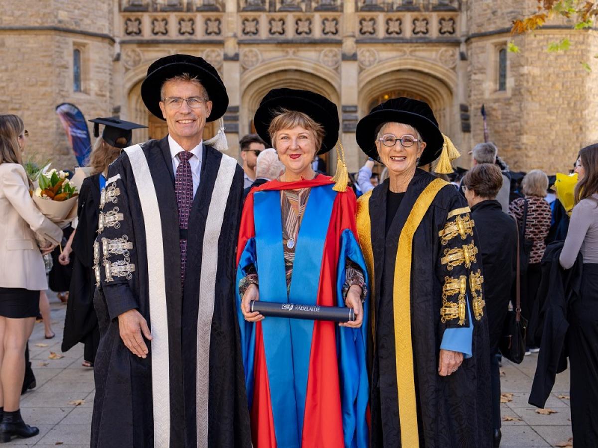 Jane Sloane receives her Honorary Doctorate from the Vice-Chancellor and Chancellor.