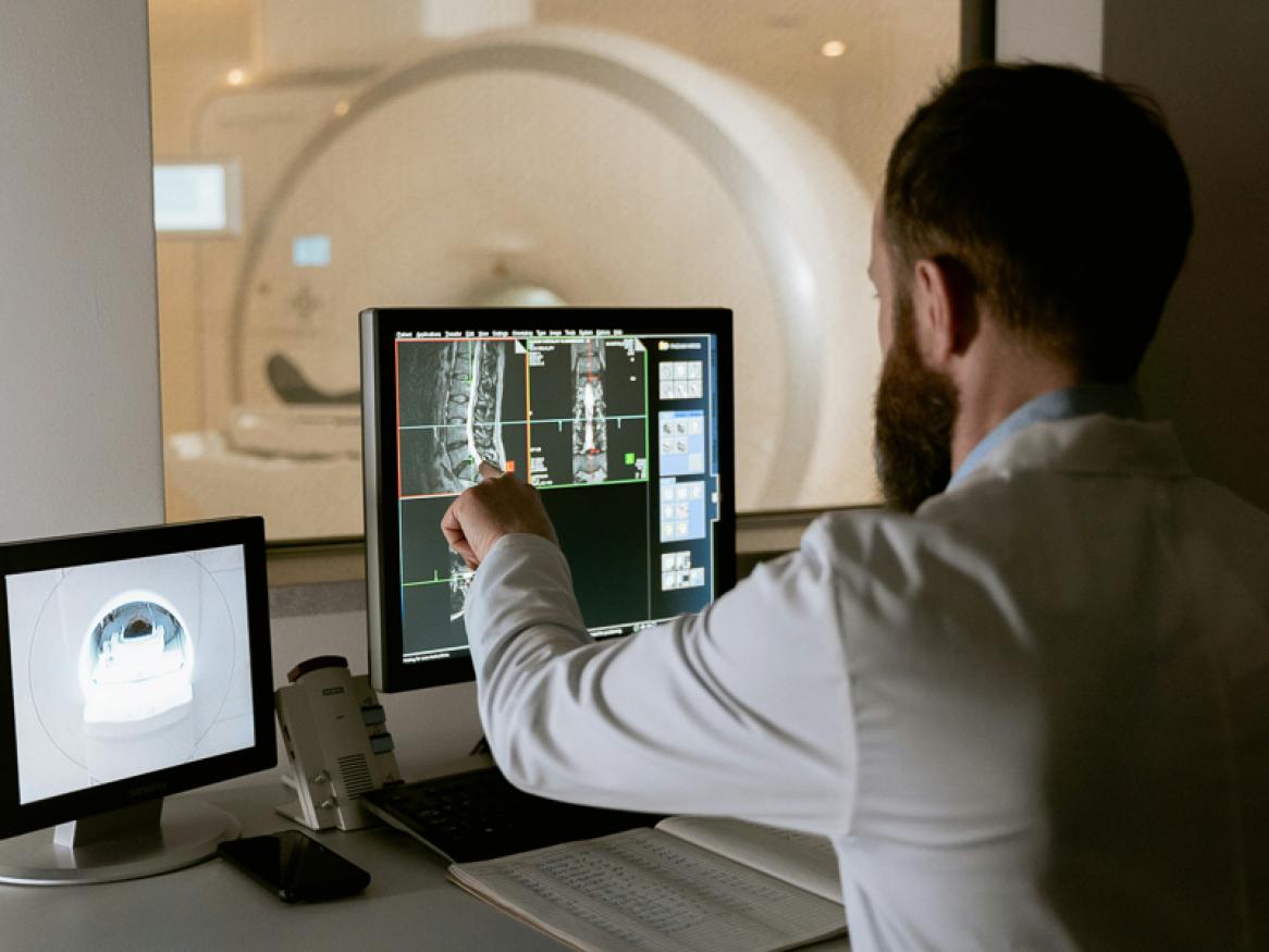 A man studies a scan on a screen. PHOTO: Mart Production