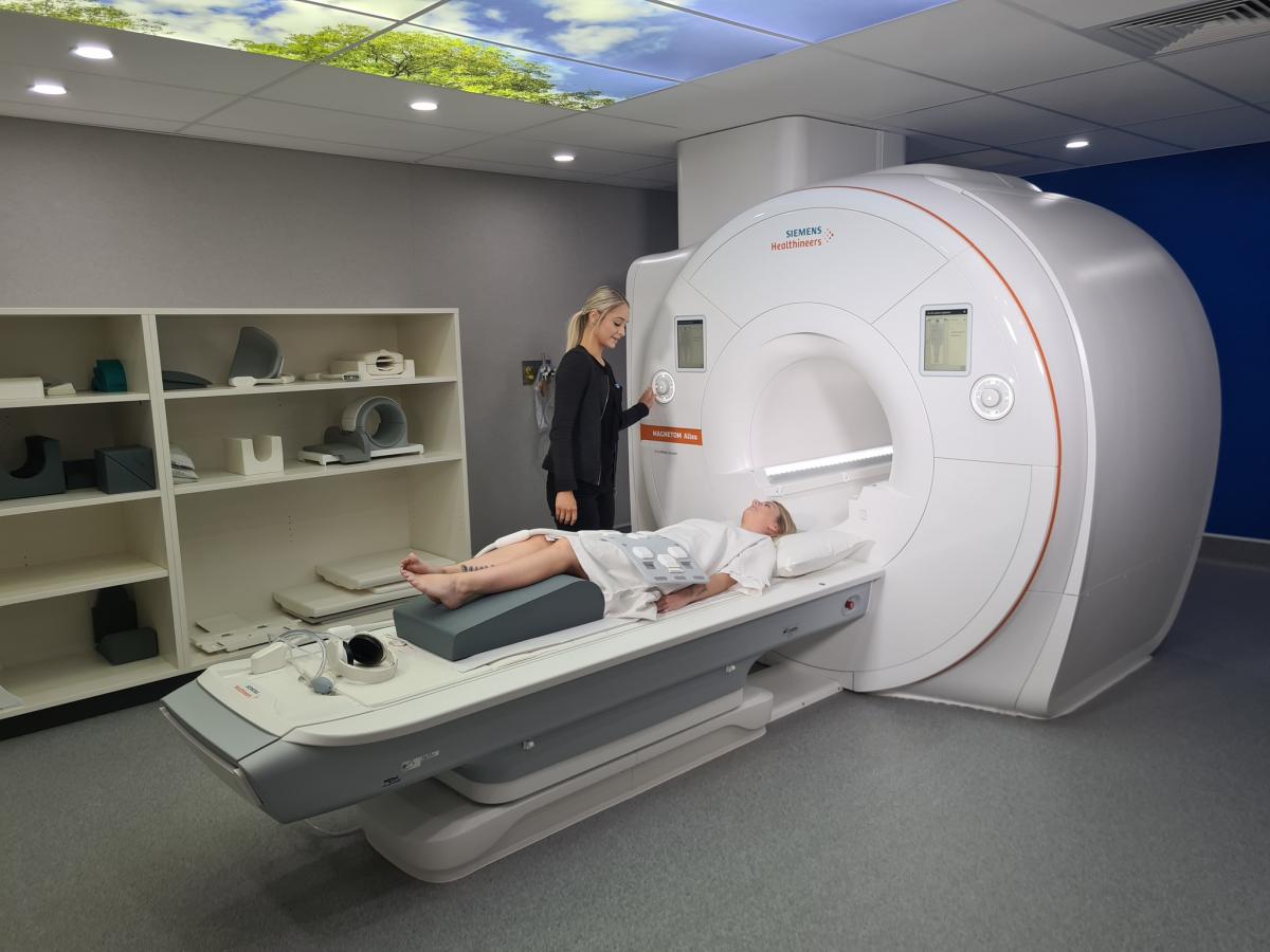 Patient being scanned via MRI