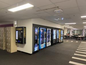 Photo of CONNECT machine attached to wall on corner near vending machines, Hub Central Level 3