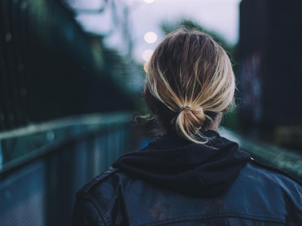 blogpic, young woman walking across a bridge