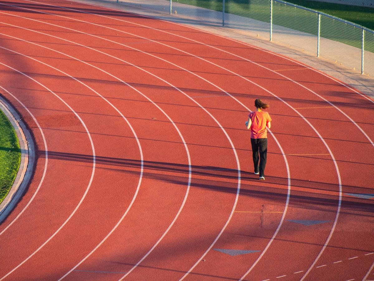 blogpic,pixabay, running track, running lanes, long shadows, woman exercising