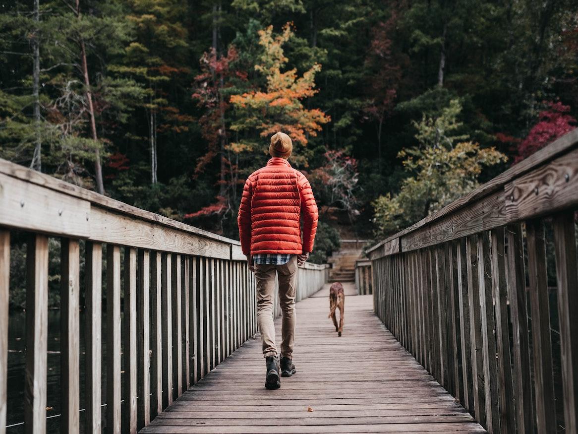 A person walking on a bridge.