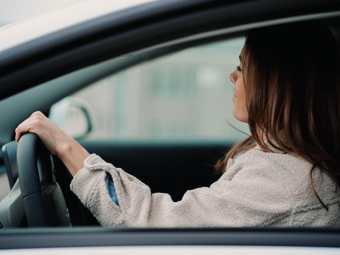 A woman driving a car.