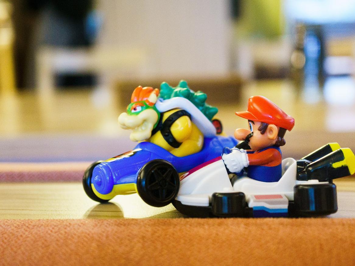 Photo of plastic figurines, Mario figures both in sports cars