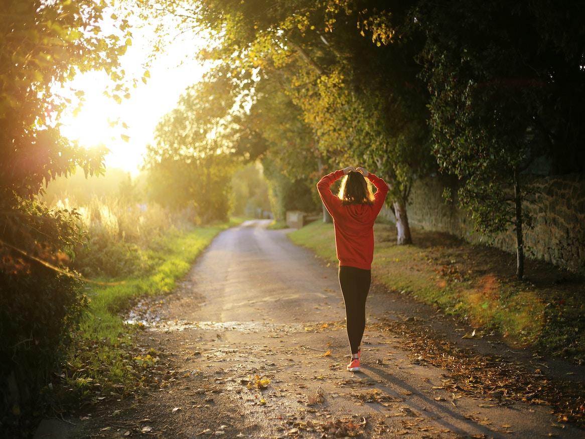 Woman walking in a park.