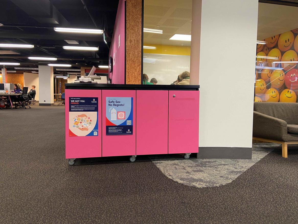 A pink cabinet with two doors located in the Barr Smith Library 