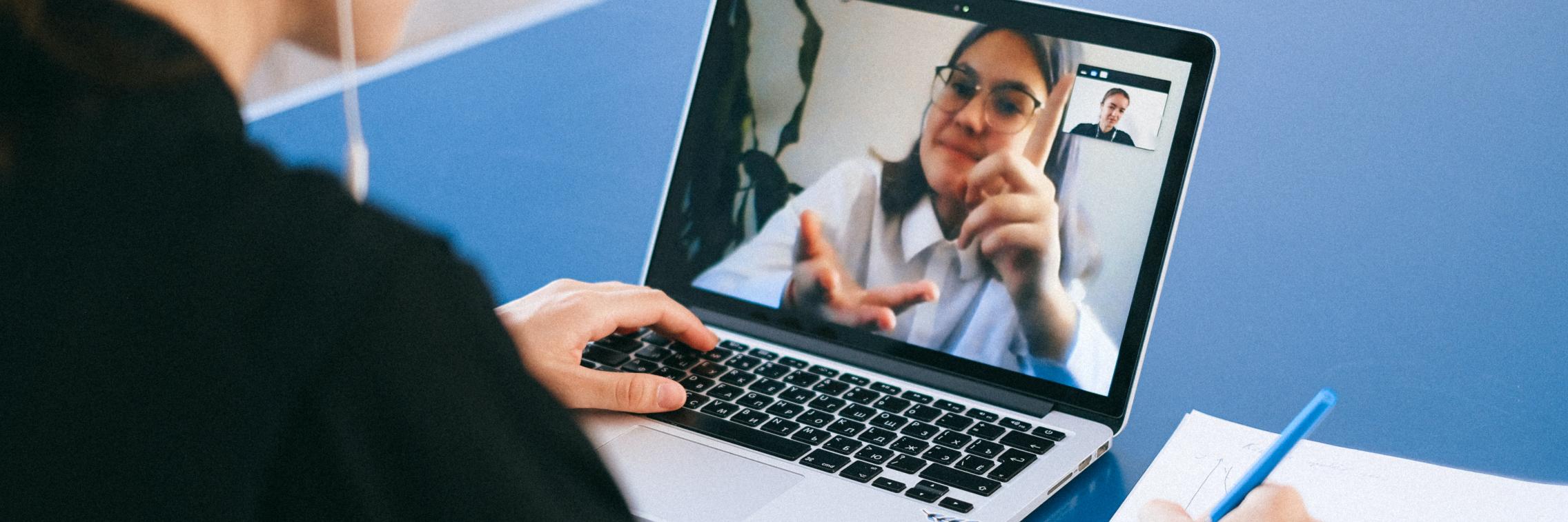 Woman videoconferencing on laptop